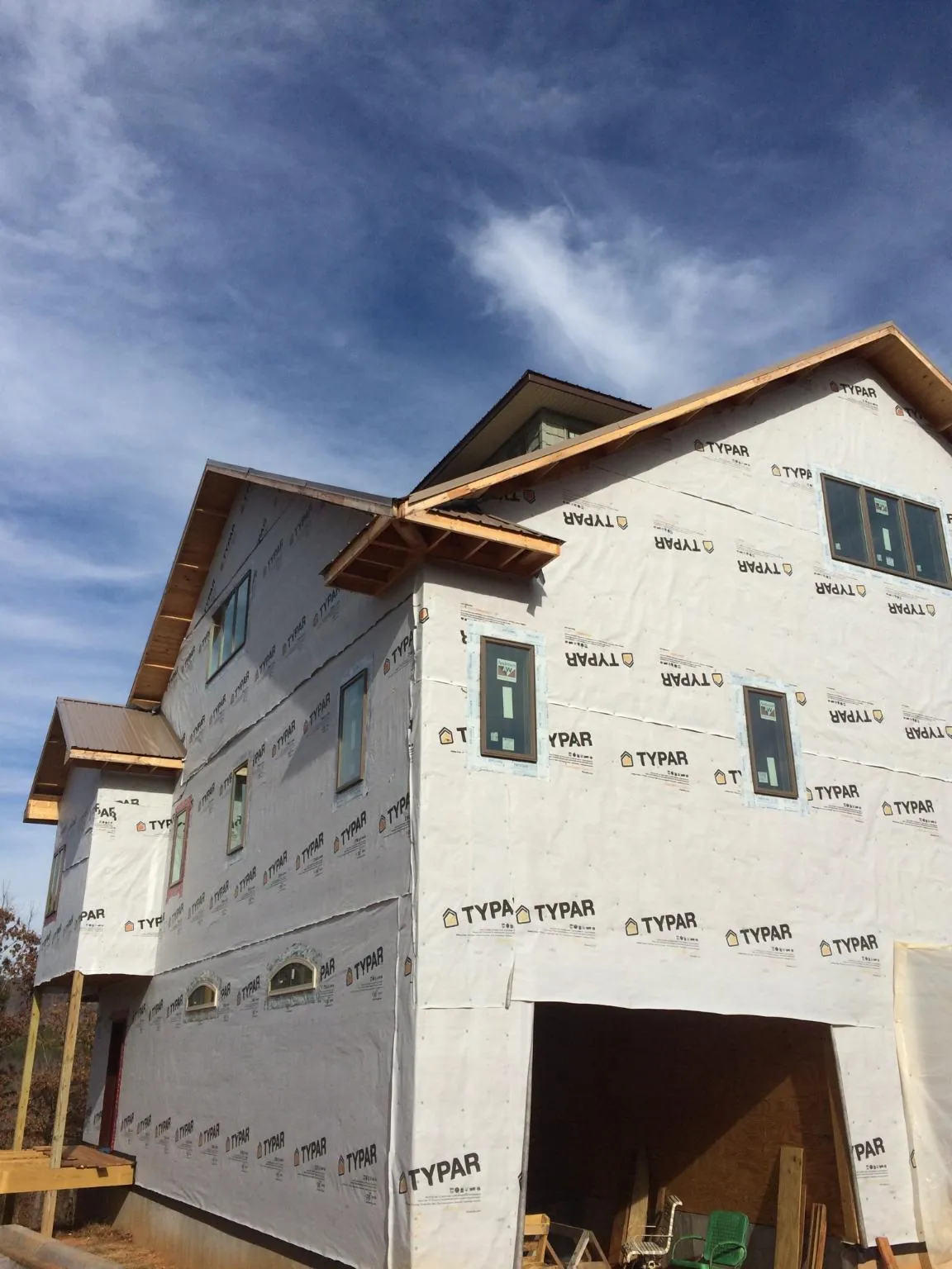 Stick built house wrapped in Typar with new roof framing and dormers in Menlo